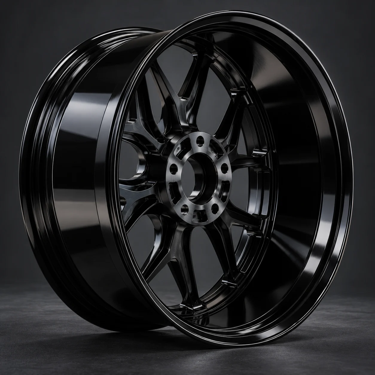 Deep-concave gloss black forged aluminum wheel at a three-quarter studio angle