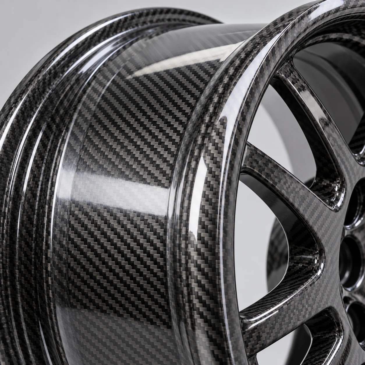 Illustrative macro of a woven carbon fiber wheel barrel and lip